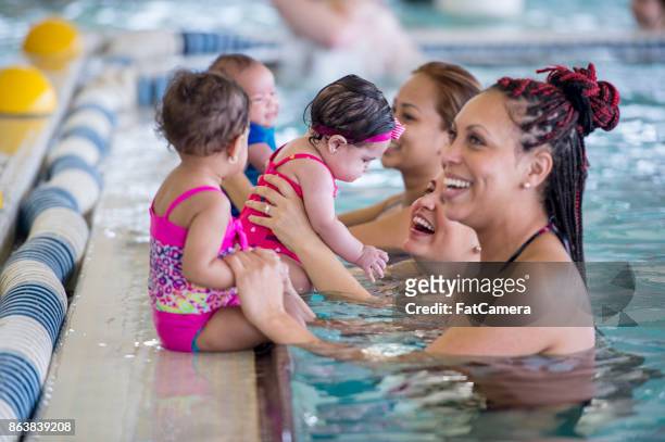 mothers with kids - aquarobics stock pictures, royalty-free photos & images
