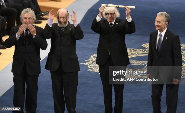 Members of Argentinian comedy-musical group Les Luthiers Carlos Nunez, Marcos Mundstock, Carlos Lopez Puccio and Jorge Luis Maronna acknowledge the...