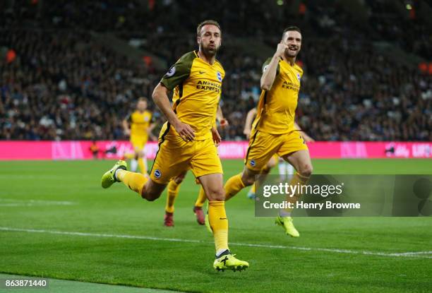 Glenn Murray of Brighton and Hove Albion celebrates as he scores their first goal during the Premier League match between West Ham United and...