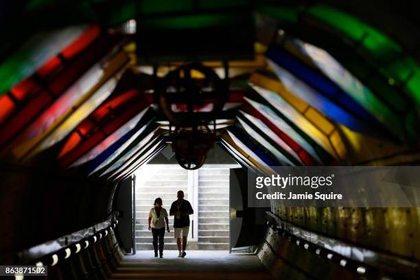 Fans walk through the tunnel during practice for the NASCAR XFINITY Series Kansas Lottery 300 at Kansas Speedway on October 20, 2017 in Kansas City,...