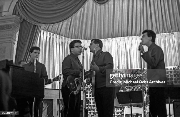 The Four Seasons perform on stage at the WMCA Good Guys concert on November 1, 1964 in New York City, New York.