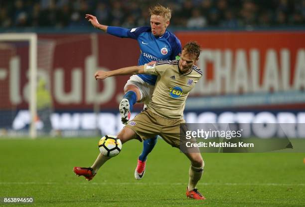 Willi Evseev of Rostock battles for the ball with Christian Gross of Osnabrueck during the third league match between FC Hansa Rostock and VfL...