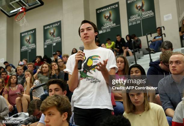 Free State High School student Chris Pendry asks as question during a forum with the four teenage candidates for Kansas Governor at Free State High...