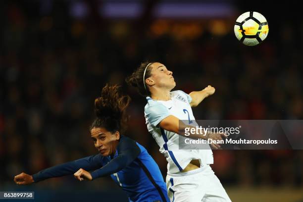 Lucy Bronze of England battles for the ball with Amel Majri of France during the International friendly match between France and England held at...