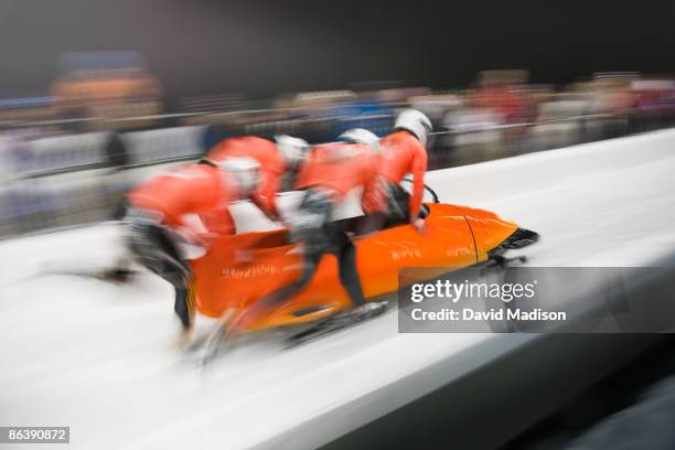 bobsled competition start. - bobsleigh team stock-fotos und bilder