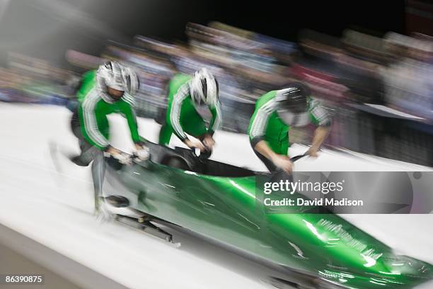 bobsled competition start. - bobsleigh team stock pictures, royalty-free photos & images