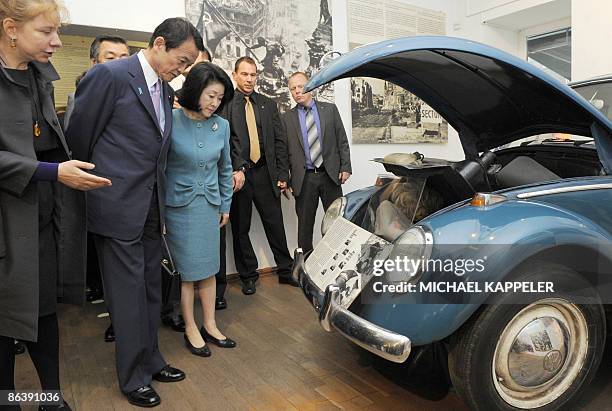 Japanese Prime Minister Taro Aso and his wife Chikako Aso listen to explanations by Alexandra Hildebrandt , director of the House at Checkpoint...