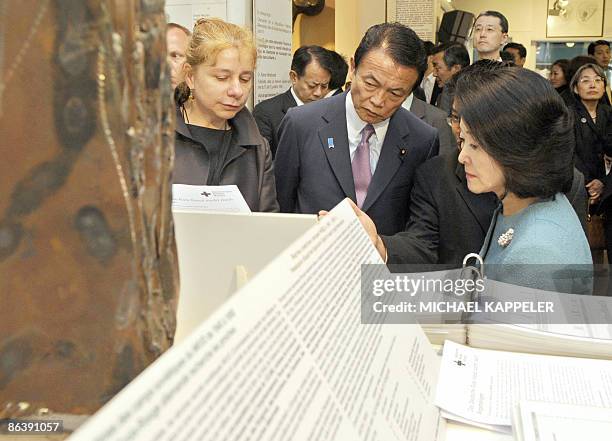 Japanese Prime Minister Taro Aso and his wife Chikako Aso listen to explanations by Alexandra Hildebrandt , director of the House at Checkpoint...