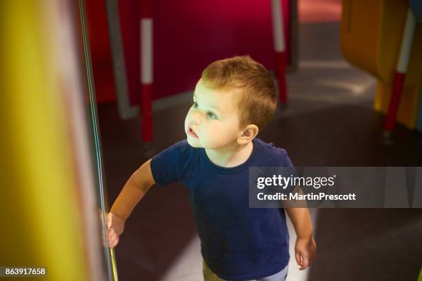 playing with interactive display in children's museum - science exhibition stock pictures, royalty-free photos & images