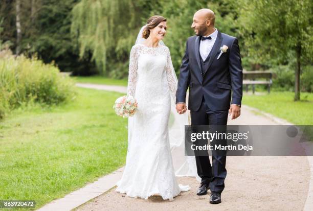 mixed race wedding - white wedding dress stock pictures, royalty-free photos & images