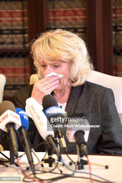 Heather Kerr, represented by attorney Gloria Allred, speak during a press conference regarding the sexual assault allegations that have been brought...