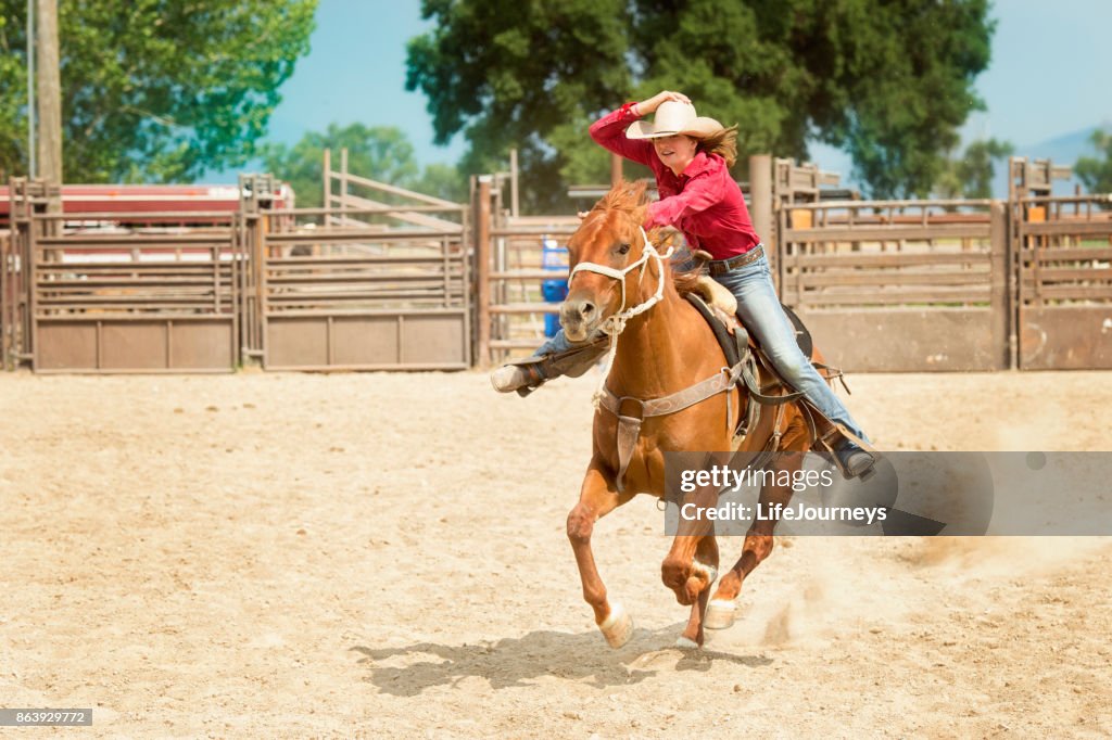 Cowgirl Bringing Her Horse Home On A Run