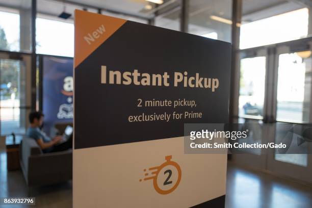 Sign advertising "Instant Pickup" in 2 minutes or less, from the Amazon Prime service of Amazon.com at UC Berkeley in Berkeley, California, October...