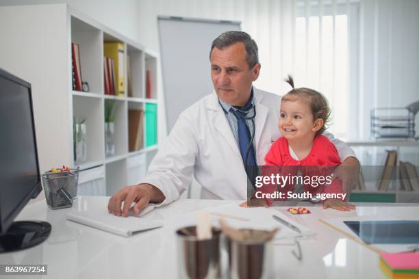 cute little girl at doktor's - doktor stock pictures, royalty-free photos & images