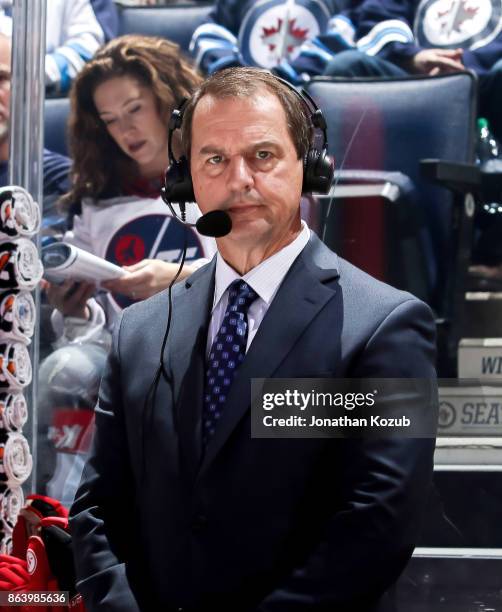 Hockey Night In Canada Colour Analyst Greg Millen looks on prior to puck drop between the Winnipeg Jets and the Carolina Hurricanes at the Bell MTS...