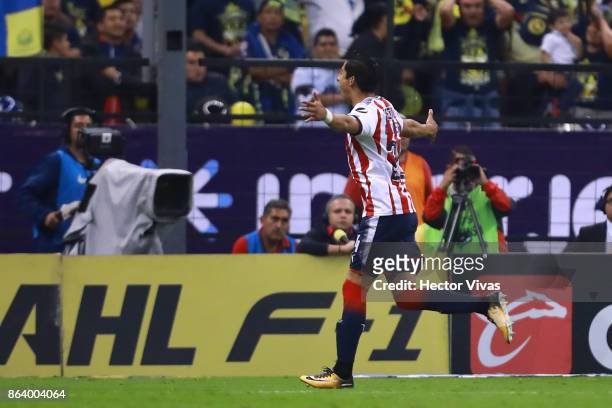 Carlos Cisneros of Chivas celebrates after scoring the first goal of his team during the 10th round match between America and Chivas as part of the...