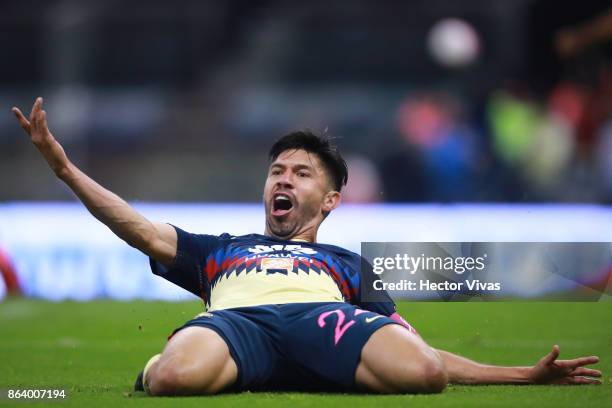 Oribe Peralta of America celebrates after scoring the first goal of his team during the 10th round match between America and Chivas as part of the...