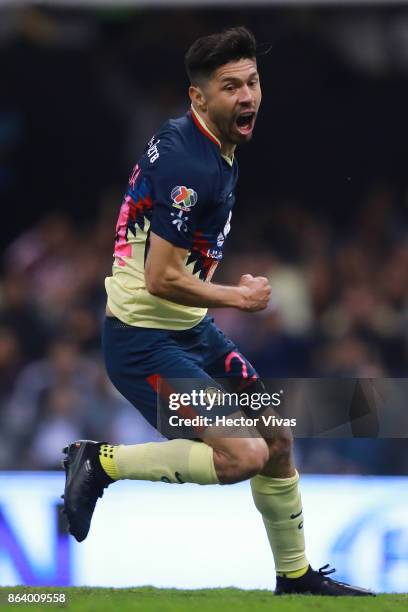 Oribe Peralta of America celebrates after scoring the first goal of his team during the 10th round match between America and Chivas as part of the...