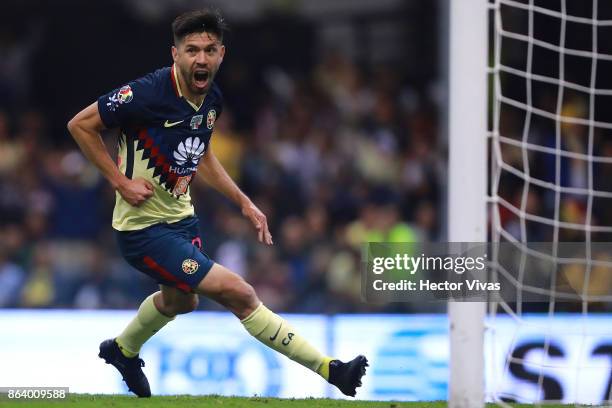 Oribe Peralta of America celebrates after scoring the first goal of his team during the 10th round match between America and Chivas as part of the...