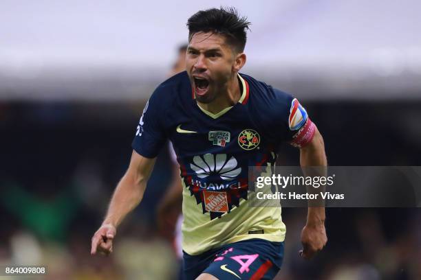 Oribe Peralta of America celebrates after scoring the first goal of his team during the 10th round match between America and Chivas as part of the...