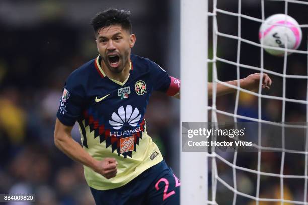 Oribe Peralta of America celebrates after scoring the first goal of his team during the 10th round match between America and Chivas as part of the...