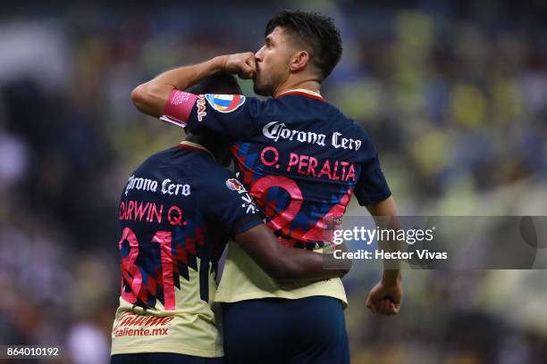 Oribe Peralta of America celebrates after scoring the first goal of his team during the 10th round match between America and Chivas as part of the...