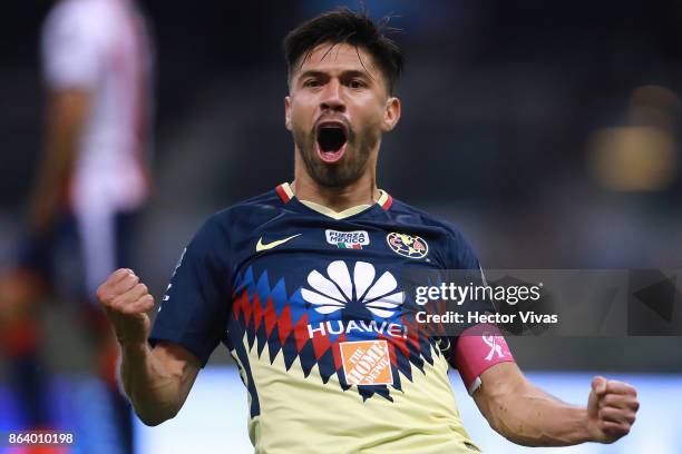 Oribe Peralta of America celebrates after scoring the first goal of his team during the 10th round match between America and Chivas as part of the...