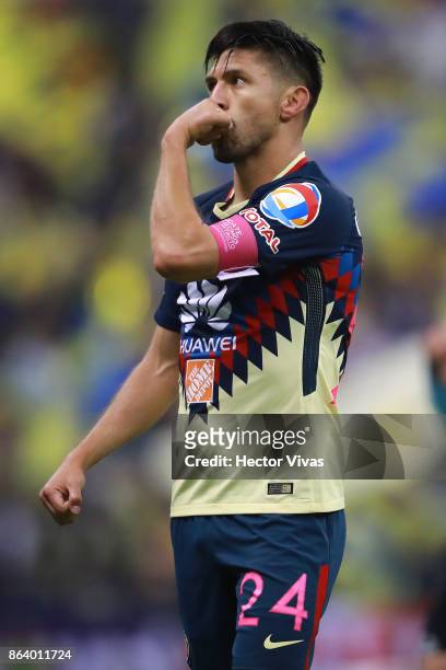 Oribe Peralta of America celebrates after scoring the first goal of his team during the 10th round match between America and Chivas as part of the...