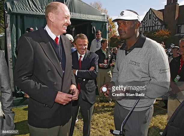 Neville Isdell, Chairman and Chief Executive Officer of Coca-Cola greets Vijay Singh during the final round of THE TOUR Championship at East Lake...