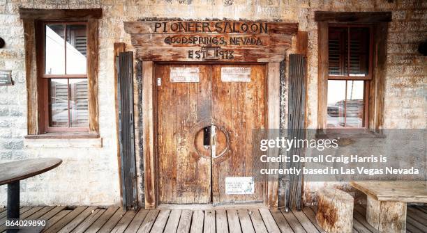 front doors of the historic pioneer saloon in goodsprings nevada - saloon photos et images de collection