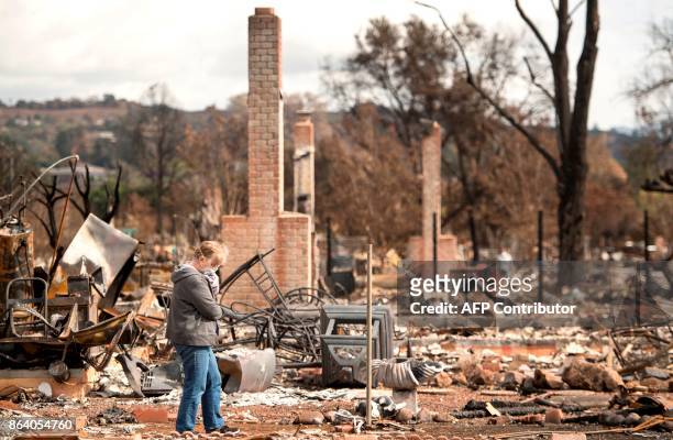 Shirley Kirk reacts while surveying the burned out property of her sister, Karen Aycock, who died during the fire in the Coffey Park area of Santa...