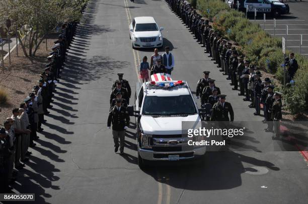 An honor guard escorts the body of Las Vegas police officer Charleston Hartfield to his funeral, October 20, 2017 in Henderson, Nevada. Hartfield was...