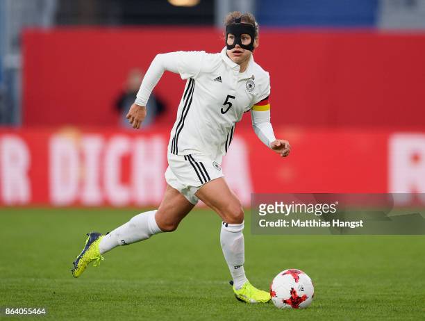 Babett Peter of Germany controls the ball during the 2019 FIFA Women's World Championship Qualifier match between Germany and Iceland at BRITA-Arena...