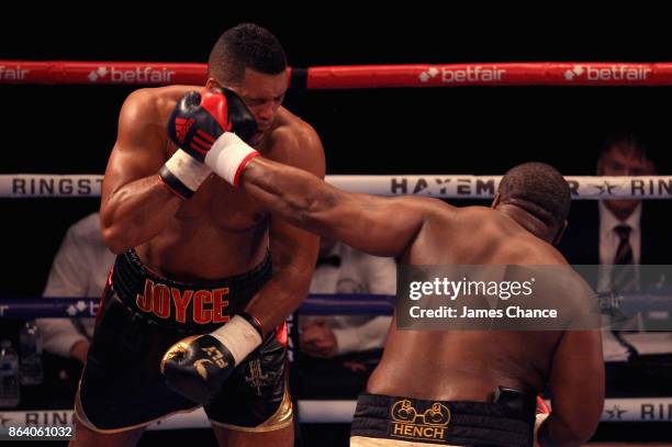 Ian Lewison punches Joe Joyce during the Heavyweight fight between Joe Joyce and Ian Lewison at The O2 Arena on October 20, 2017 in London, England.