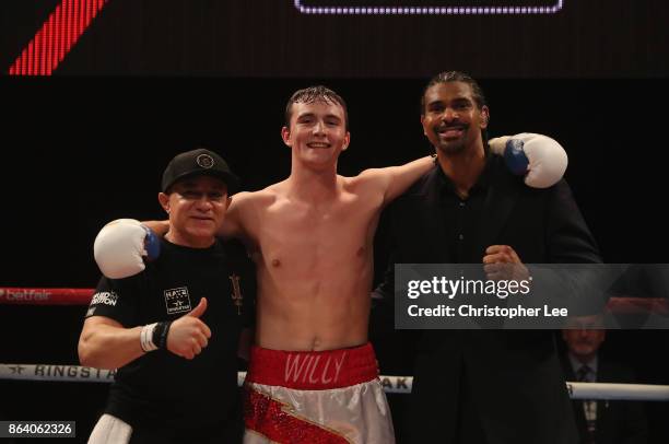 Willy "Braveheart" Hutchinson celebrates his victory over Attila Tibor Nagy in a Light-Heavyweight fight with his trainer and David Haye during the...