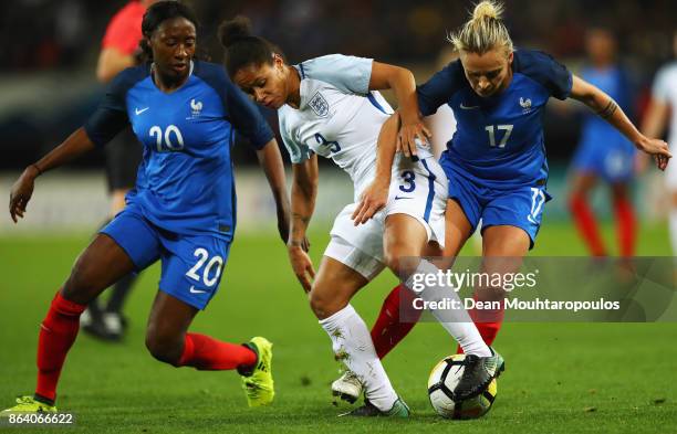 Demi Stokes of England batt Marion Torrent of France during the International friendly match between France and England held at Stade du Hainaut on...