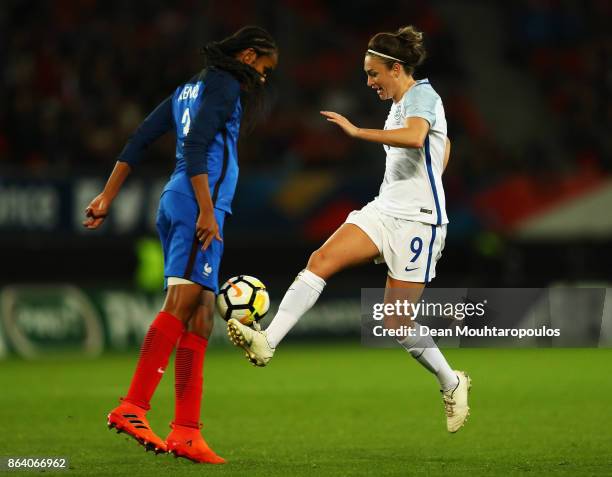 Jodie Taylor of England battles for the ball with Wendie Renard of France during the International friendly match between France and England held at...