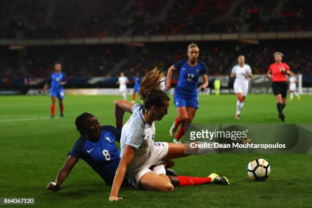 Hawa Cissoko of France tackles Jill Scott of England during the International friendly match between France and England held at Stade du Hainaut on...