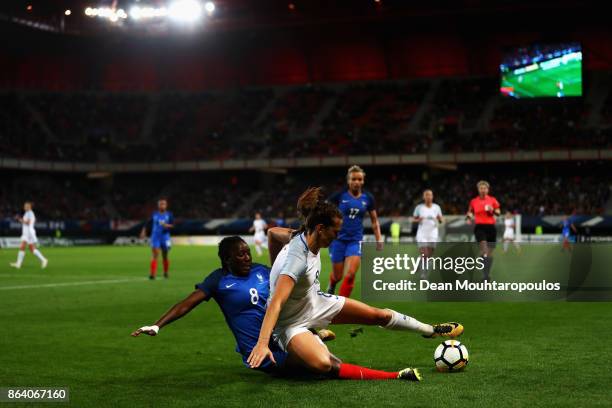 Hawa Cissoko of France tackles Jill Scott of England during the International friendly match between France and England held at Stade du Hainaut on...