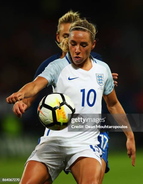 Jordan Nobbs of England battles for the ball with Marion Torrent of France during the International friendly match between France and England held at...