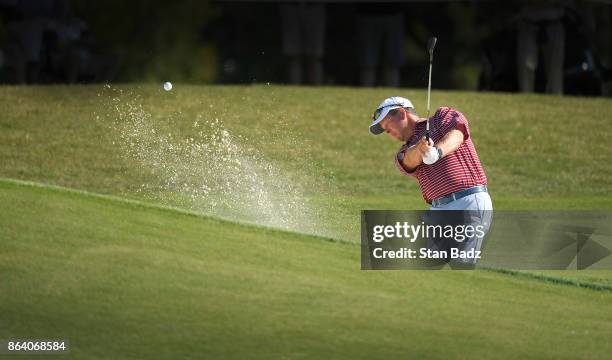 Glen Day plays a bunker shot on the 18th hole during the first round of the PGA TOUR Champions Dominion Energy Charity Classic at The Country Club of...