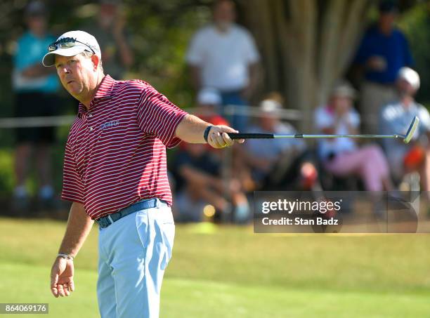 Glen Day reacts to his putt on the 18th hole during the first round of the PGA TOUR Champions Dominion Energy Charity Classic at The Country Club of...