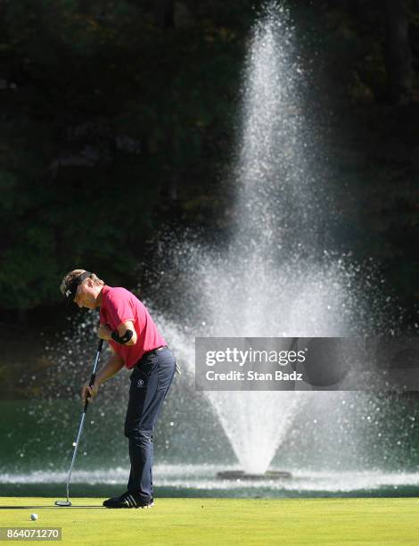 Bernhard Langer hits a putt on the first hole during the first round of the PGA TOUR Champions Dominion Energy Charity Classic at The Country Club of...