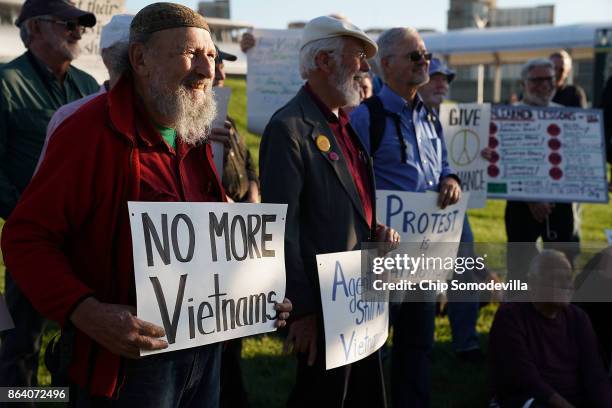 About 100 people gather outside the Pentagon to commemorate the 50th anniversary of the 1967 March on the Pentagon October 20, 2017 in Arlington,...