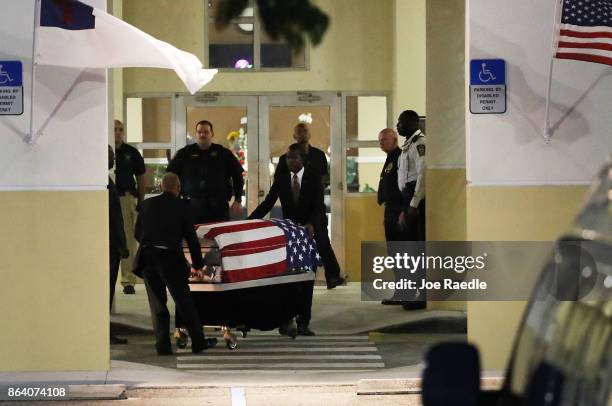 The casket of U.S. Army Sgt. La David Johnson is wheeled to the hearse after the viewing at the Christ the Rock Community Church on October 20, 2017...