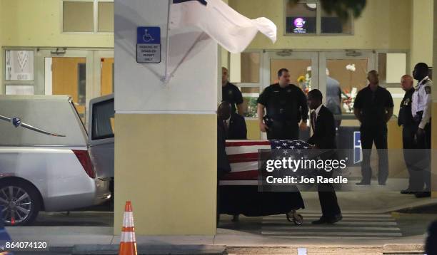 The casket of U.S. Army Sgt. La David Johnson is wheeled to the hearse after the viewing at the Christ the Rock Community Church on October 20, 2017...