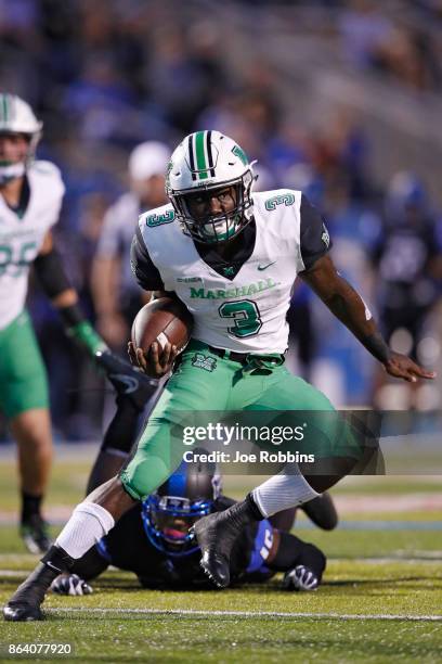 Tyler King of the Marshall Thundering Herd runs for a 15-yard touchdown in the first quarter of a game against the Middle Tennessee Blue Raiders at...