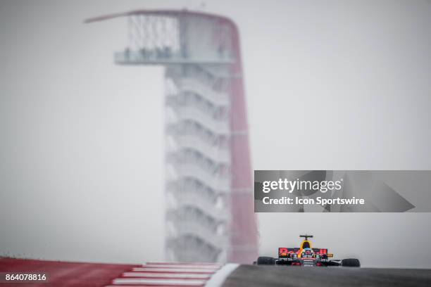 Red Bull Racing driver Daniel Ricciardo of Australia crests hill over turn 10 with COTA tower in background during morning practice for the Formula 1...