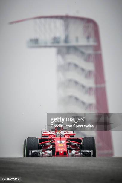 Ferrari driver Sebastian Vettel of Germany races through turn 10 with COTA tower in background during morning practice for the Formula 1 United...