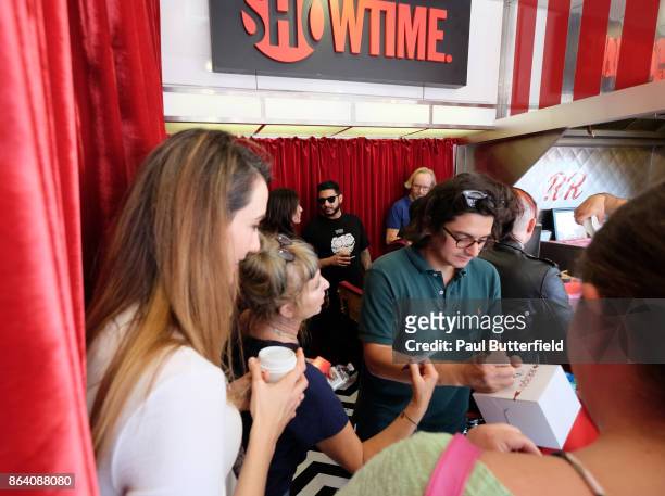Actors Madeline Zima, Kimmy Robertson, and Josh Fadem sign merchandise at Showtime's "Twin Peaks" Double R Diner Pop-Up on Melrose Avenue on October...